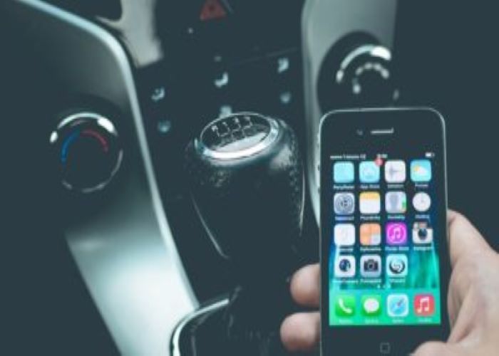 Person In Car Using Smartphone 