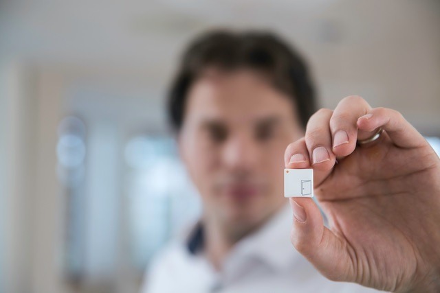 Tiny Smart Sensors Erik Fossum Holding Sensor