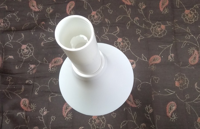 Rod inserted in top canopy of smart fan connected to Microcontroller.