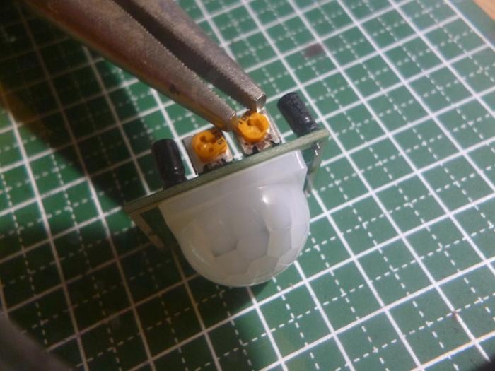 Pliers Turning Raspberry Pi Motion Sensor Screw For Adjustment