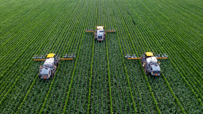 Vehicular Farm Equipment Over Field James Baltz