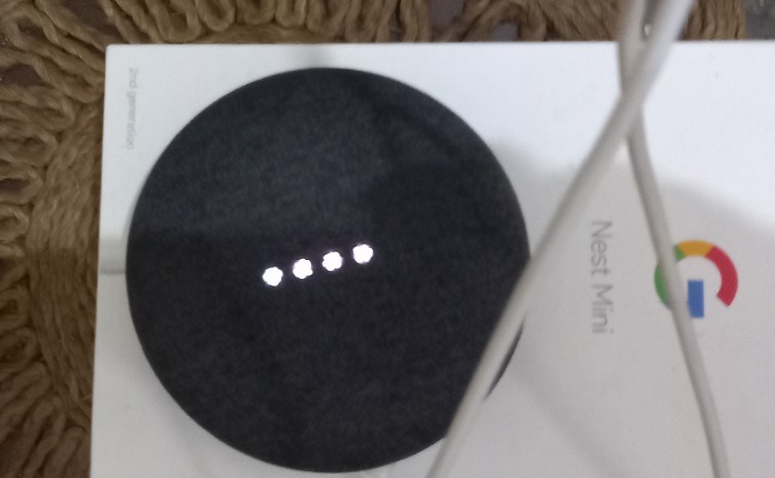 Google Nest Mini white lights blinking for listening mode.