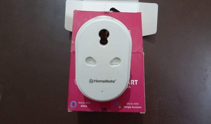 16A Smart plug device unboxed and with three pins visible 