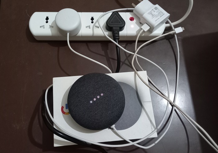 Nest Mini and other connection cables connected to smart power strip. 