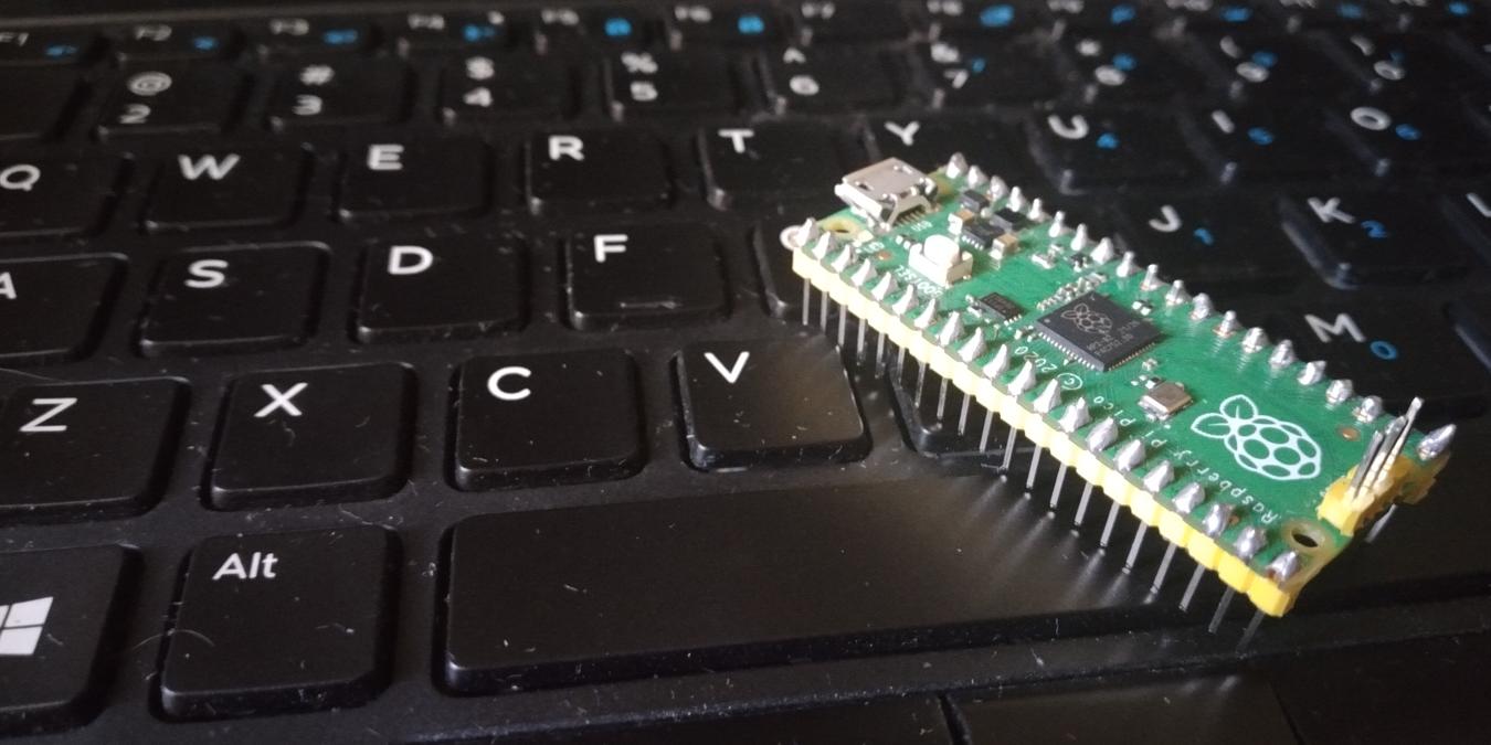 Raspberry Pi Pico Over Dell Laptop Keyboard Feature Image
