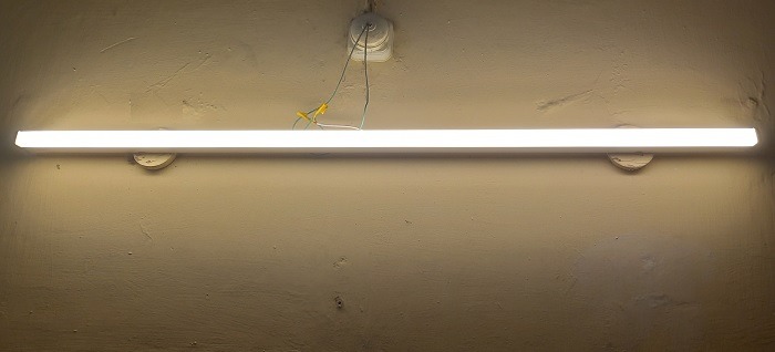 Smart batten in candlelight mode controlled from a Google Home (Nest Mini) speaker.