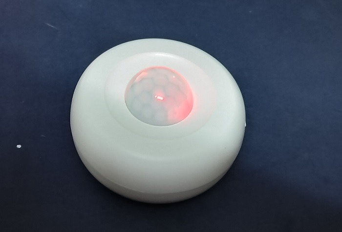 Indicator lights flashing quickly in a motion sensor to enable device reset activities. 