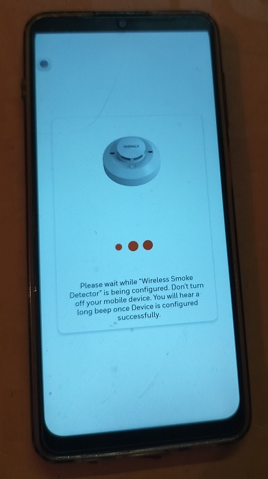 Wireless smoke detector being configired on mobile app (Android).